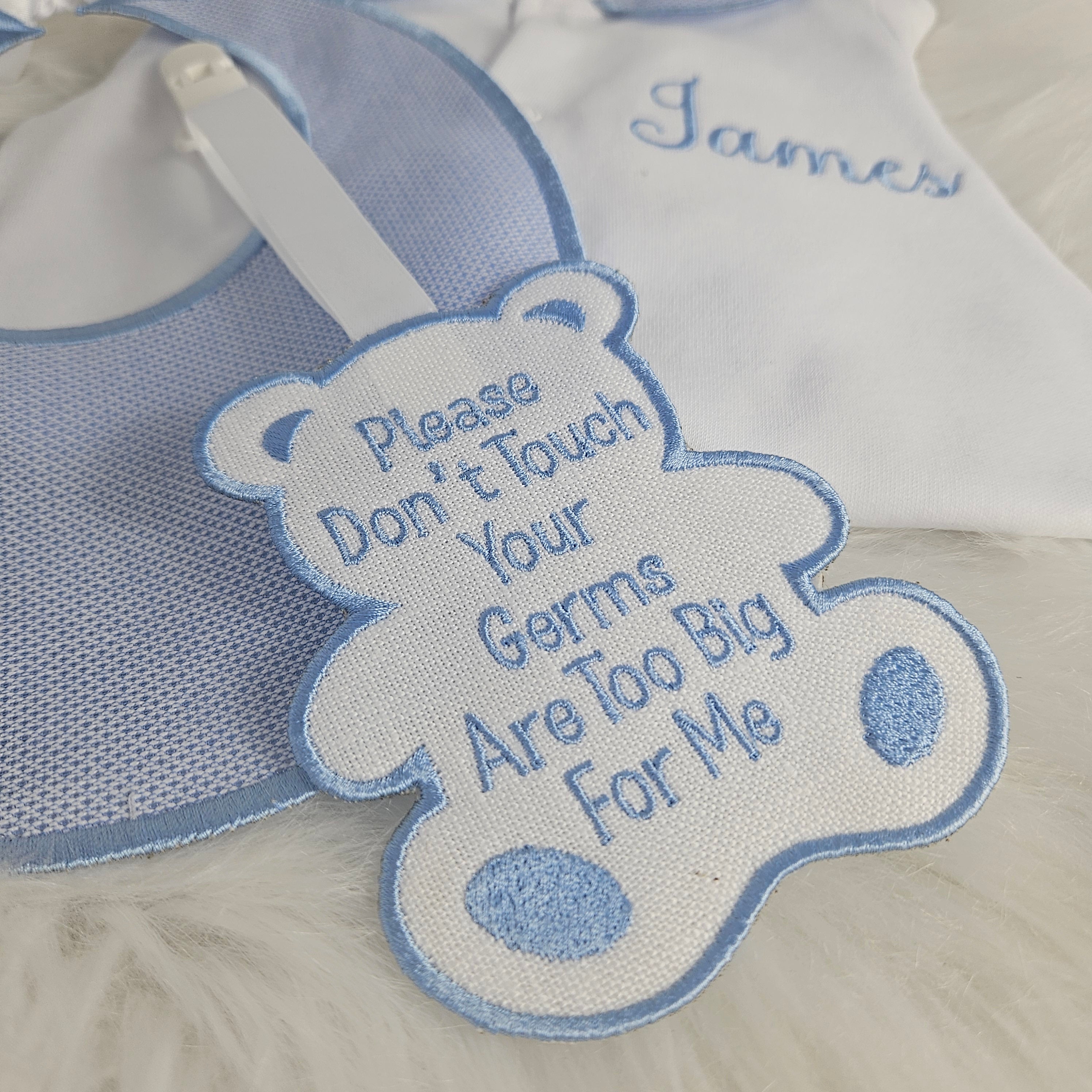 Blue collar sleepsuit bib tag